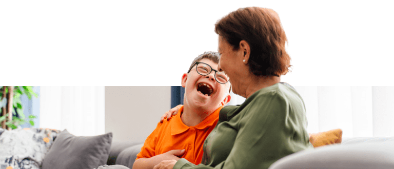 Little boy with down syndrome enjoy spending time with his caregiver